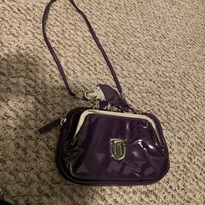 Small purple clutch bag